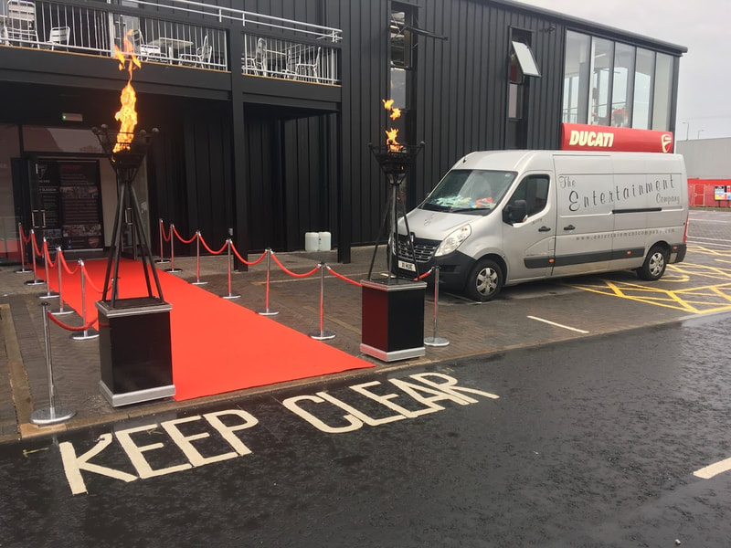 Red Carpet, Ropes and Poles with Gas Flambeux Show room opening Glasgow Scotland